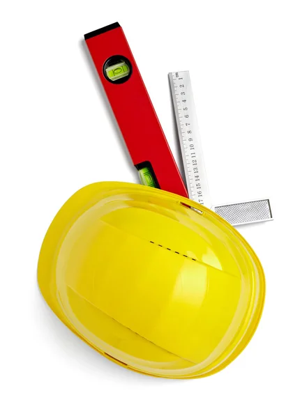 Construction helmet protective workwear ruler level — Stock Photo, Image