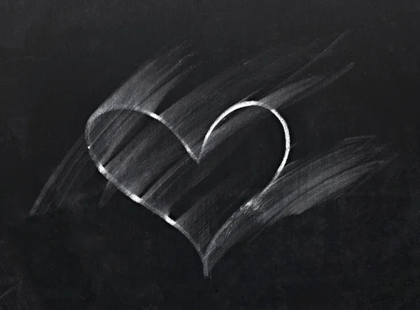 Smudge erased heart on chalkboard — Stock Photo, Image