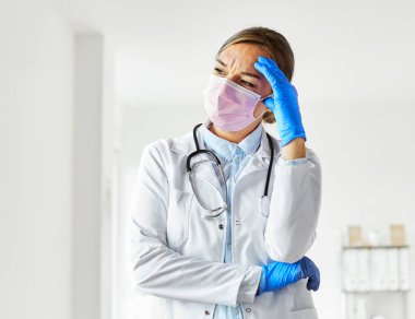 doctor medical mask exhausted hospital coronavirus health tired virus woman nurse pandemic care medicine