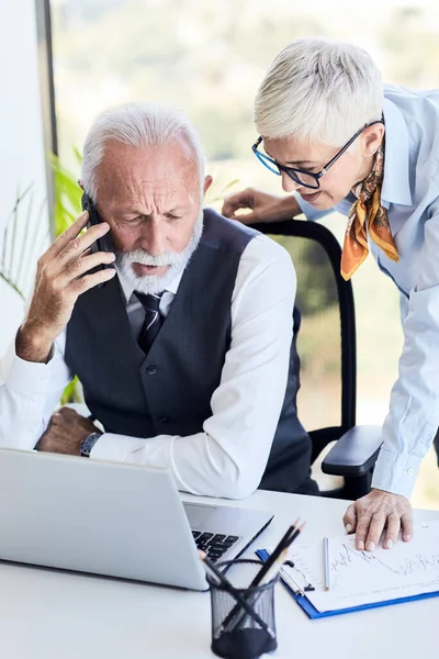 stock image senior busniess people talking office communication