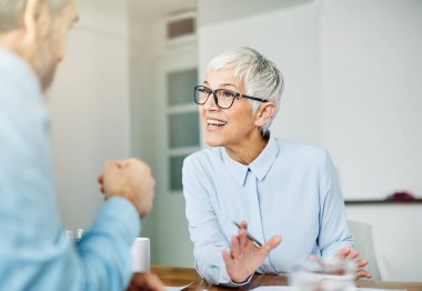 business office person discussion document papers teamwork senior meeting