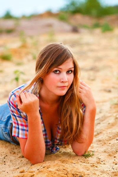 Blonde woman model with large breasts plaid shirt and jeans in t — Stock Photo, Image