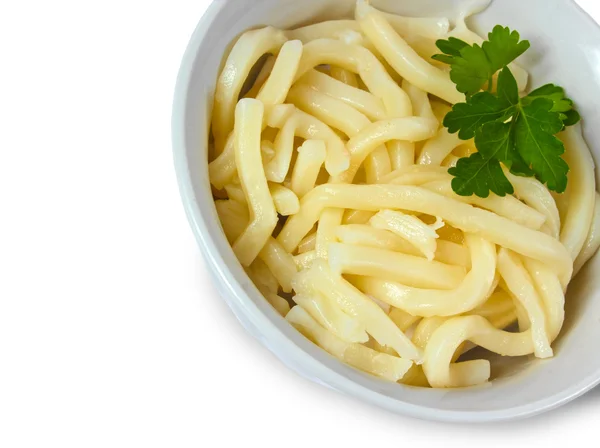 Cooked pasta and parsley in a bowl isolated on white background — Stock Photo, Image