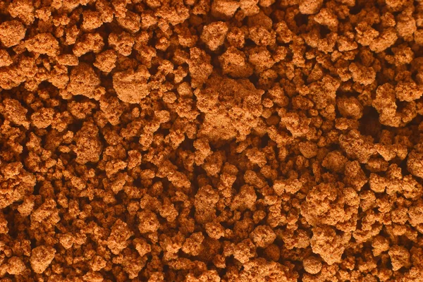 Granulowanym kakao tekstura tło super makro — Zdjęcie stockowe
