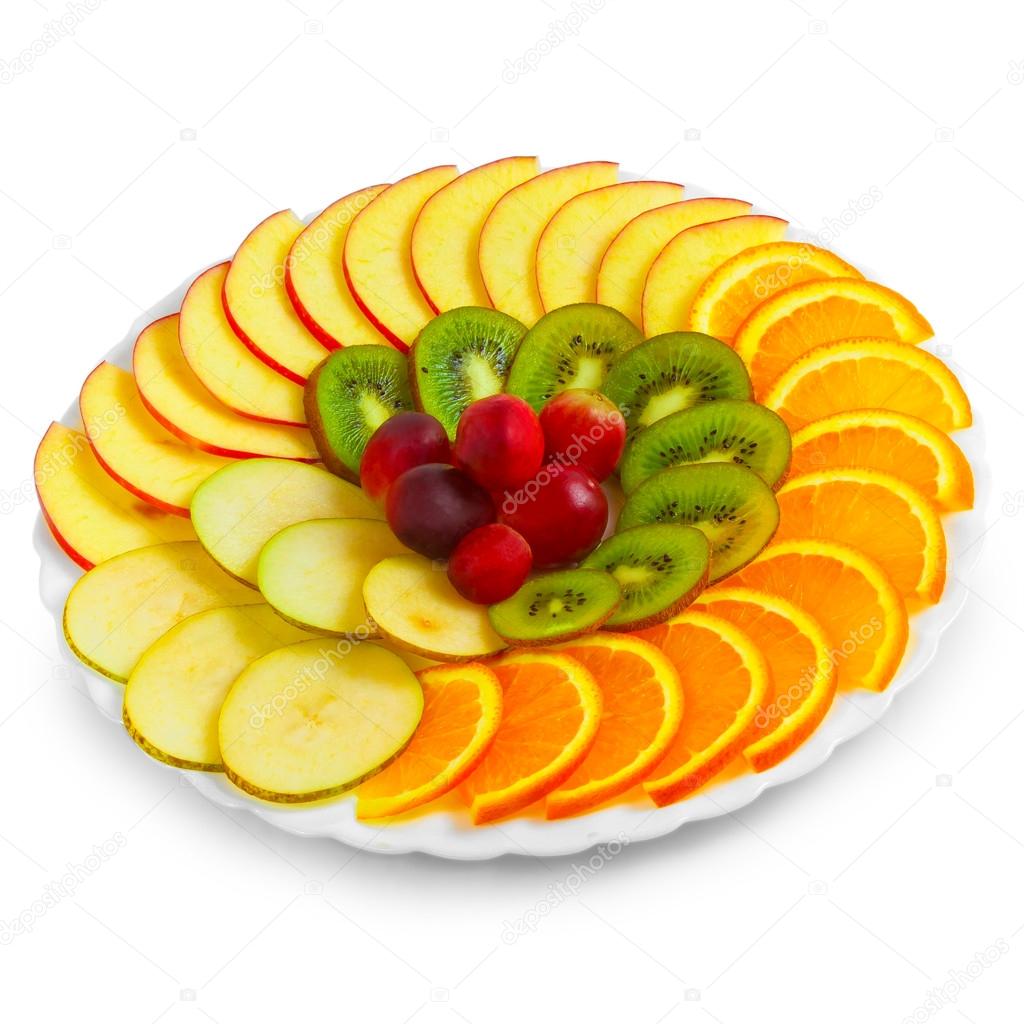 Salad of apples oranges grapes kiwi fruit slices on a plate isol