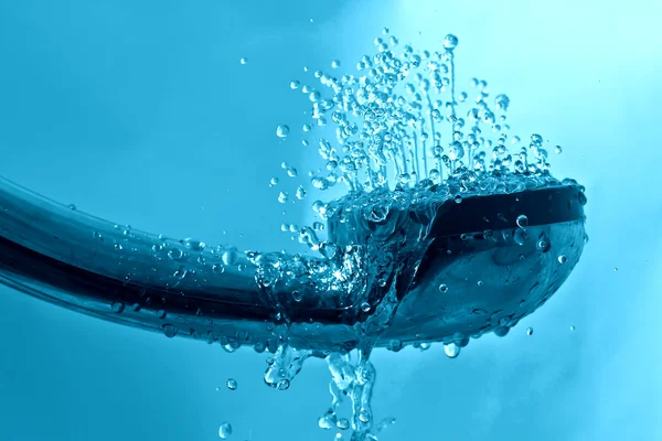 Fresh shower and drops and sprays water on a blue background tex — Stock Photo, Image