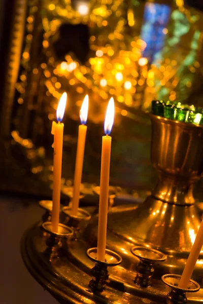 Lighting candles in russian orthodox church — Stock Photo, Image