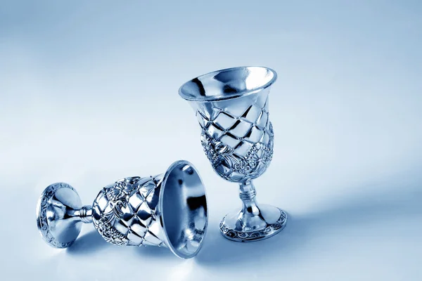 Old silver goblet on a blue background — Stock Photo, Image