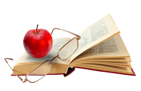 Aufgeschlagenes Buch und Brille roter Apfel auf weißem Hintergrund (Ausschnitt — Stockfoto