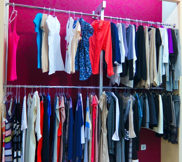 Shop different with clothes shopping, racks and shelves with wom — Stock Photo, Image