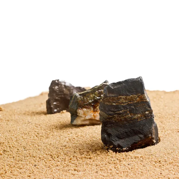 A homok textúráját elszigetelt három kő — Stock Fotó
