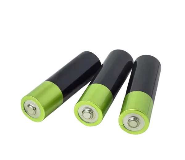 Batterij groene drie geïsoleerd op witte achtergrond uitknippad — Stockfoto