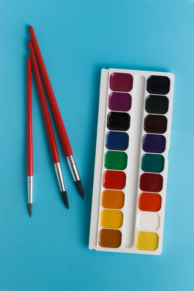 Brush for watercolors and watercolor paints for children on a bl — Stock Photo, Image