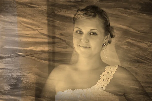 Retro sepia black and white photo Bride blonde woman stands and — Stock Photo, Image