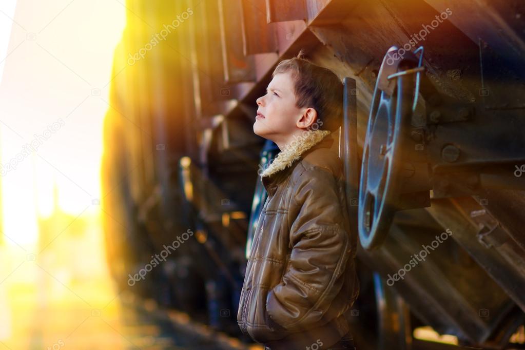 sunlight boy bum blonde in brown jacket and crumpled jeans on st