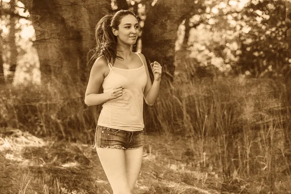 Bruna donna giovane corridore correre all'aperto, stile di vita prospettiva — Foto Stock