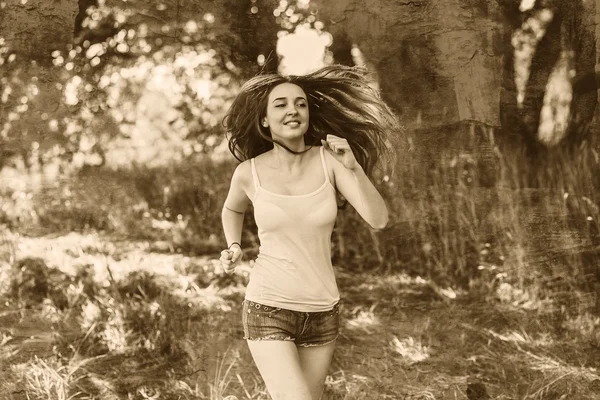 Young Brunette Woman runner running outdoors, the prospect of a — Stock Photo, Image