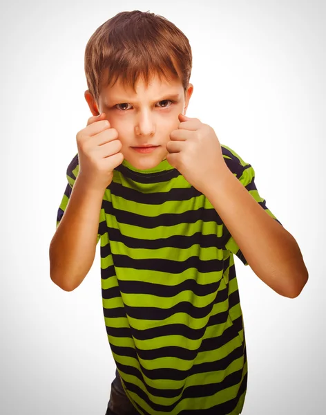 Bad child boy blond bully angry aggressive fights in striped gre — Stock Photo, Image