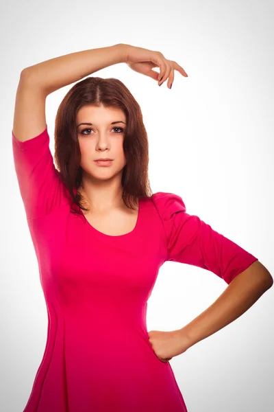 Woman brunette girl in a pink dress — Stock Photo, Image