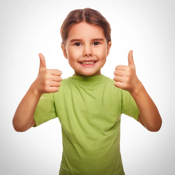 Baby girl raised her thumbs up smiling symbol indicates yes emot — Stock Photo, Image