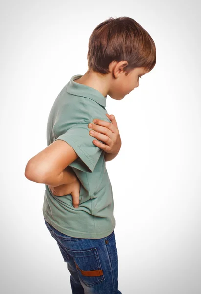 Osteochondrosis teenage boy holds his hand behind back — Stock Photo, Image