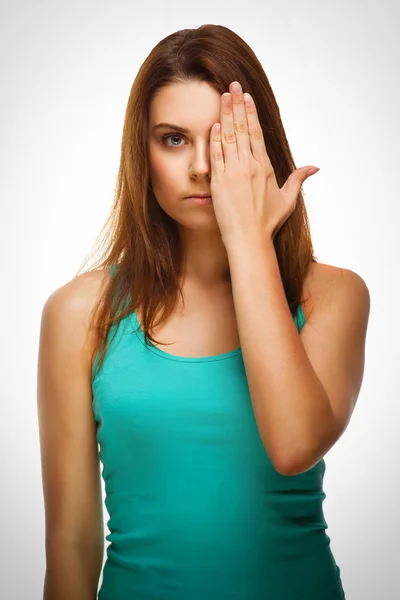 Woman brunette girl covered her face half hand — Stock Photo, Image