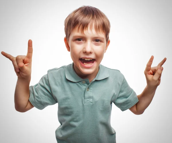 Boy teenager shows kid gesture hands metal rock devil emotion background — Stock Photo, Image