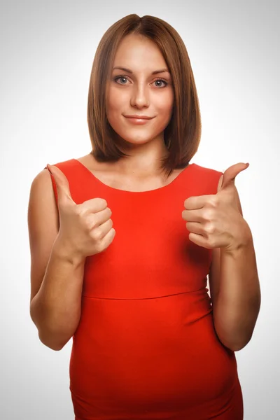 Girl woman young positive sign thumbs yes in red dress emotion background — Stock Photo, Image