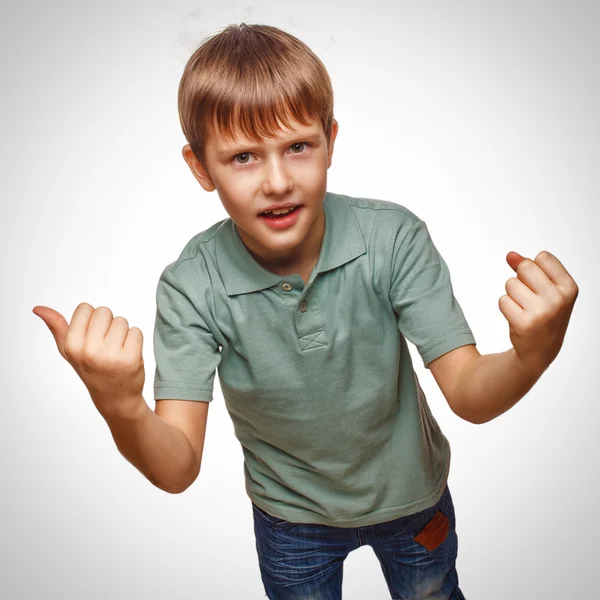 Happy child teen excited teenage boy shows hand so his fists — Stock Photo, Image