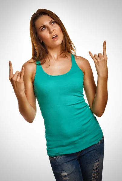 Woman girl shows sign devil rock metal in jeans emotion background — Stock Photo, Image