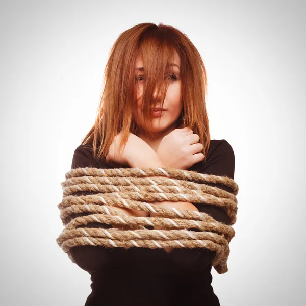 Woman prisoner tied rope hostage female bondage bound girl slave — Stock Photo, Image