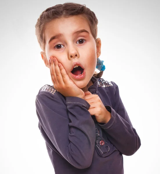 Girl surprised little teenager feels joy holding hand on face is — Stock Photo, Image