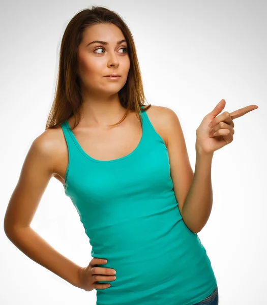 Surprised woman shows finger in direction hand isolated on white — Stock Photo, Image