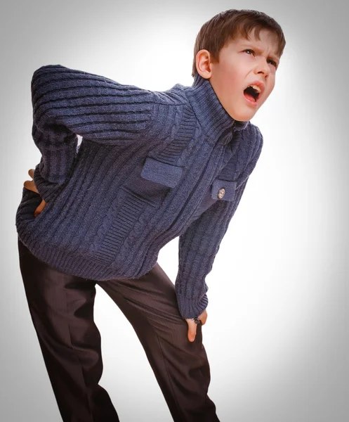 Gray teenage osteochondrosis boy holds teenager his hand behind — Stock Photo, Image