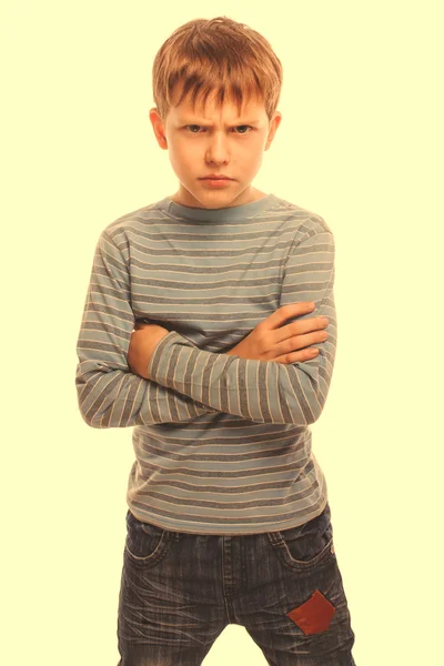 Angry child teenage boy experiencing anger blonde in a striped s — Stock Photo, Image