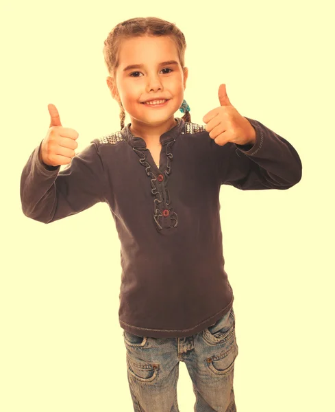 Dziecko dziewczynka nastolatek podniósł jej kciuki do góry na białym tle symbol uśmiechający się — Zdjęcie stockowe