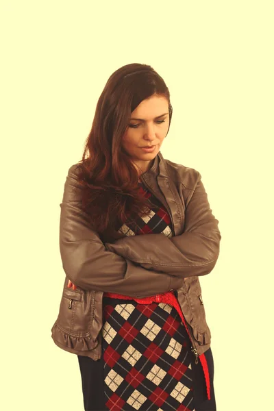 Brunette girl in leather jacket and plaid autumn dress looking d — Stock Photo, Image
