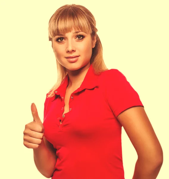 Happy woman young girl shows positive sign thumbs yes, in red sh — Stock Photo, Image