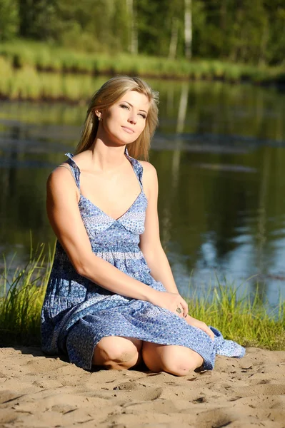 Beautiful young woman in sundress — Stock Photo, Image