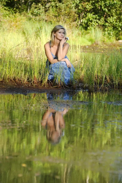 Beautiful young woman in sundress — Stock Photo, Image