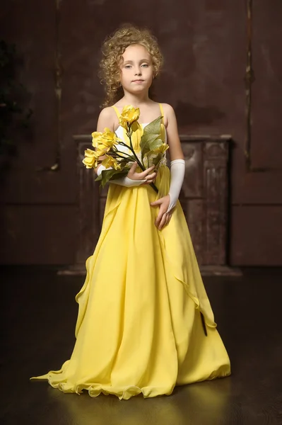 Girl in a yellow dress — Stock Photo, Image