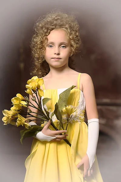 Girl in a yellow dress — Stock Photo, Image