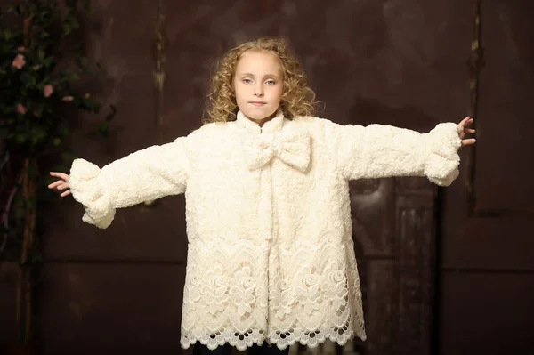 Girl in a stylish coat of artificial fur — Stock Photo, Image