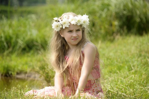 Girl with a wreath of flowers — Stock Photo, Image
