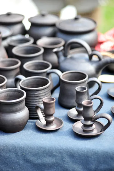 Clay jugs and cups with saucers — Stock Photo, Image