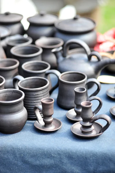 Clay jugs and cups with saucers — Stock Photo, Image