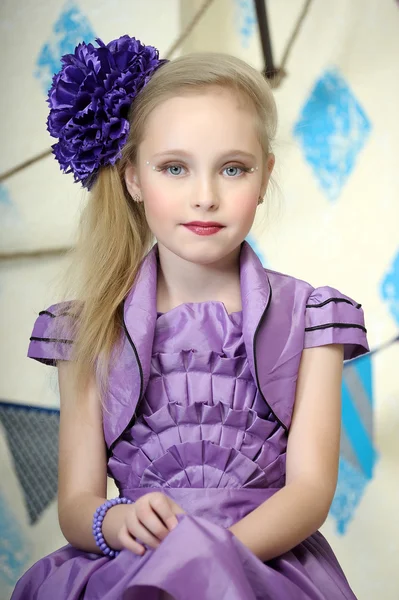 Beautiful teenager in purple dress — Stock Photo, Image