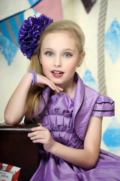 Beautiful teenager in purple dress — Stock Photo, Image