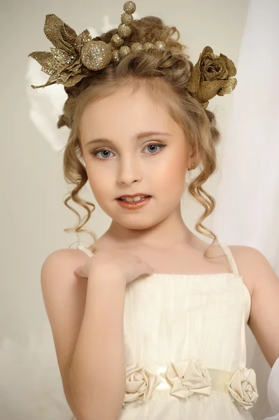 Portrait of a girl with a golden wreath on head — Stock Photo, Image