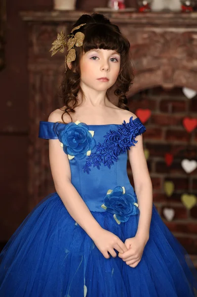 Little girl in an elegant blue dress — Stock Photo, Image